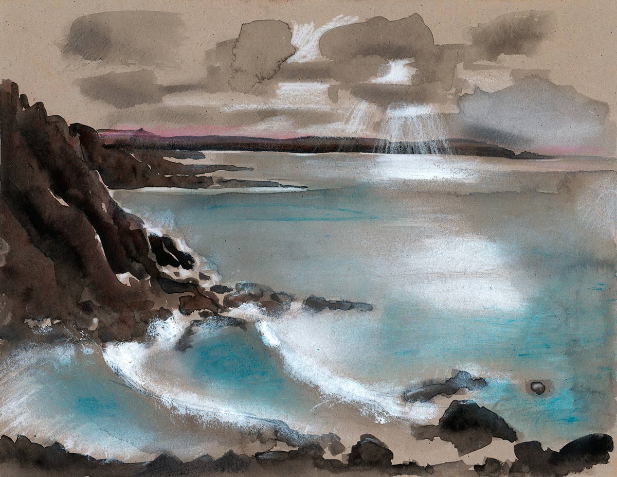 Waves at a rocky beach with distant headland and sun rays poking through clouds