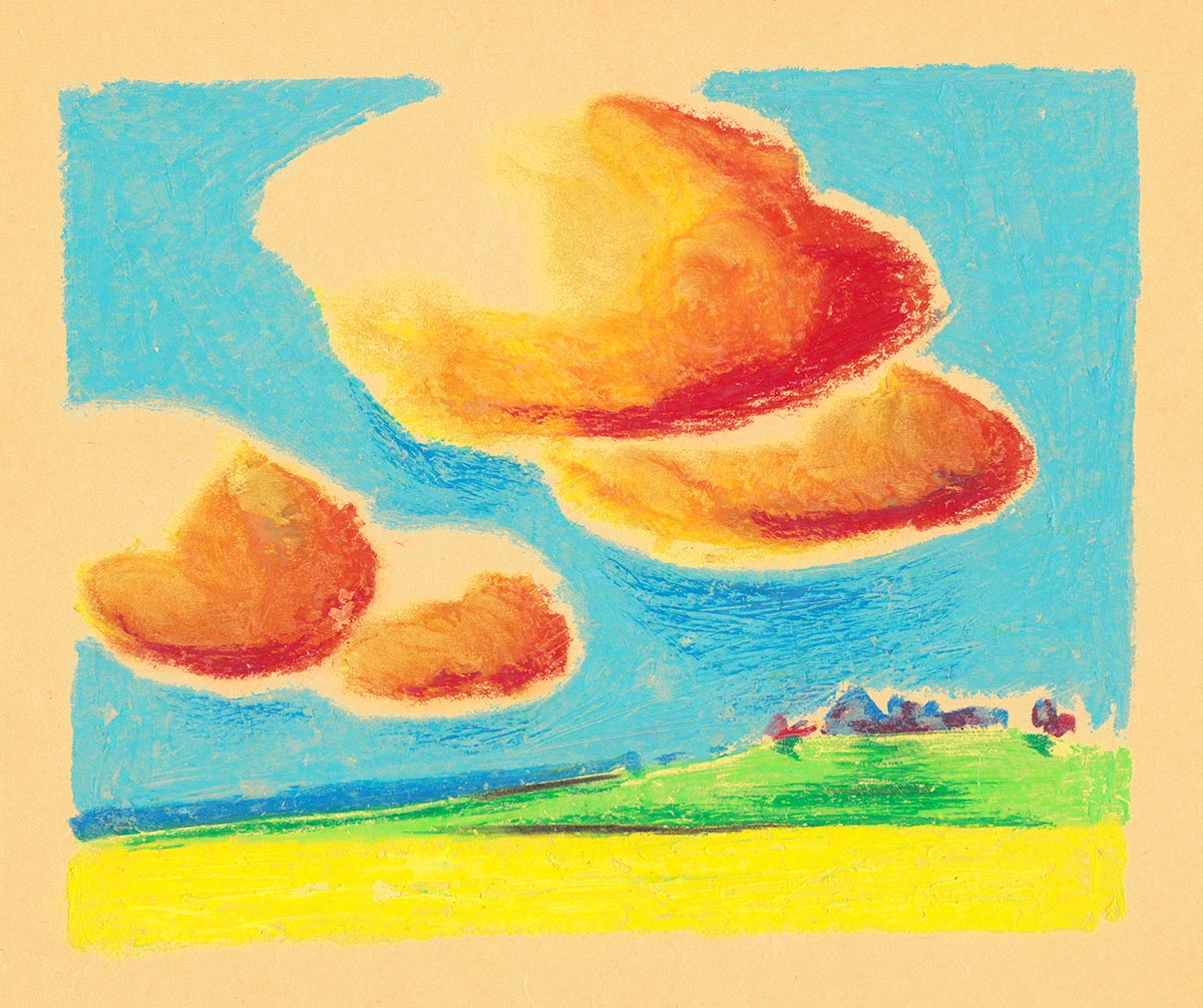 Orange clouds in the sky with a village on the hill in the distance