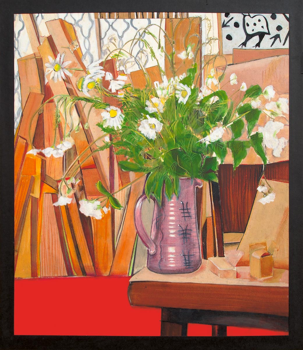 Wild flowers in a vase with stack of wood in background