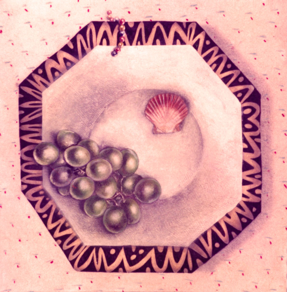 A bowl with grapes a shell and beads in it.